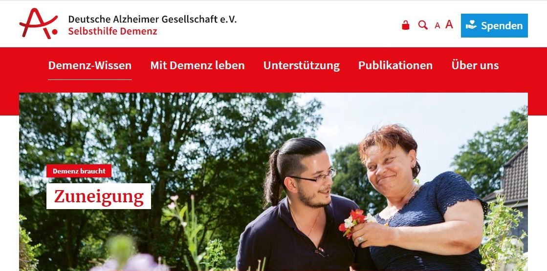 junger Mann überreicht älterer Frau Blumen. Text: Demenz braucht Zuneigung junger Mann überreicht älterer Frau Blumen. Text: Demenz braucht Zuneigung